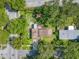 Aerial view shows a home's location on the corner of a tree-lined neighborhood street at 1901 Loch Berry Rd, Winter Park, FL 32792