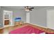 This bedroom features hardwood floors, a ceiling fan, and an ensuite bathroom at 1940 S Conway Rd # 8, Orlando, FL 32812