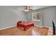 Cozy bedroom with hardwood floors, a bright window, and neutral wall color at 1940 S Conway Rd # 8, Orlando, FL 32812