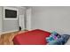 This bedroom features hardwood floors and a comfortable interior at 1940 S Conway Rd # 8, Orlando, FL 32812