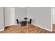 Cozy dining area featuring hardwood floors and a modern table set for four at 1940 S Conway Rd # 8, Orlando, FL 32812
