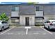 Charming townhouse with well-maintained landscaping and dedicated parking spaces out front at 1940 S Conway Rd # 8, Orlando, FL 32812