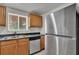 Well-equipped kitchen with stainless steel appliances and ample countertop space at 1940 S Conway Rd # 8, Orlando, FL 32812