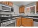 Efficient kitchen with stainless steel appliances, and sleek countertops at 1940 S Conway Rd # 8, Orlando, FL 32812