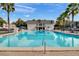 Inviting community pool with clear blue water and plenty of seating at 1940 S Conway Rd # 8, Orlando, FL 32812
