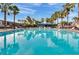 Expansive community pool with turquoise water and a covered lounge area at 1940 S Conway Rd # 8, Orlando, FL 32812