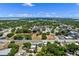 Panoramic aerial view of neighborhood with beautiful cityscape and tranquil lake at 209 N 14Th St, Leesburg, FL 34748