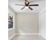 Bright bedroom featuring wood-look tile floors, new windows, ceiling fan, and closet at 209 N 14Th St, Leesburg, FL 34748