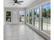 Bright sun room with lots of windows and a white door at 209 N 14Th St, Leesburg, FL 34748