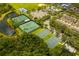 Community aerial view with tennis courts, basketball courts, baseball field, playground and scenic pond at 2246 Florida Soapberry Blvd, Orlando, FL 32828
