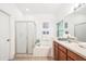 Bright bathroom with a shower stall, soaking tub, and single sink vanity with lots of counter space at 2246 Florida Soapberry Blvd, Orlando, FL 32828