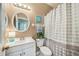 Well-lit bathroom featuring a shower and tub combo and a single sink vanity at 2246 Florida Soapberry Blvd, Orlando, FL 32828