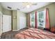 Bedroom featuring decorative drapes, luxury vinyl plank flooring, and a ceiling fan at 2246 Florida Soapberry Blvd, Orlando, FL 32828