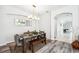 Elegant dining area features modern lighting, stylish table setting, and a cohesive design at 2246 Florida Soapberry Blvd, Orlando, FL 32828
