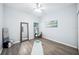 Large flex room with luxury vinyl plank floors, a large mirror, and neutral paint at 2246 Florida Soapberry Blvd, Orlando, FL 32828