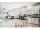 Open kitchen with an island, stainless steel appliances and views of the living area at 2246 Florida Soapberry Blvd, Orlando, FL 32828