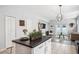 Open concept living with kitchen island and stainless steel appliances at 2246 Florida Soapberry Blvd, Orlando, FL 32828