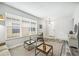Bright living room boasts large windows, modern flooring, and chic decor for comfortable living at 2246 Florida Soapberry Blvd, Orlando, FL 32828