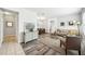 Spacious living area with elegant wood flooring, designer decor, and an open concept layout at 2246 Florida Soapberry Blvd, Orlando, FL 32828
