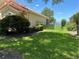 Backyard and fence overlooking water view beyond fence at 2258 Rickover Pl, Winter Garden, FL 34787