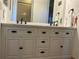 Bathroom vanity with dual sinks and black hardware at 2258 Rickover Pl, Winter Garden, FL 34787