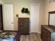 Bedroom with closet, dresser, and dinosaur decorations at 2258 Rickover Pl, Winter Garden, FL 34787