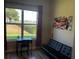 Bedroom with a desk, a futon, colorful wall art, and laminate floors at 2258 Rickover Pl, Winter Garden, FL 34787