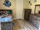 Bedroom with laminate floors, wooden furniture and superhero decor at 2258 Rickover Pl, Winter Garden, FL 34787