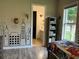 View of bedroom with superhero decor, laminate floors, and view to bathroom at 2258 Rickover Pl, Winter Garden, FL 34787