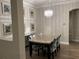 Chic dining room features modern chandelier and seating for four at 2258 Rickover Pl, Winter Garden, FL 34787