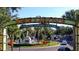 Grand entrance to The Grove Winter Garden Village, featuring a fountain and lush landscaping at 2258 Rickover Pl, Winter Garden, FL 34787