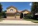 Beautiful two-story home featuring a three-car garage and red-tiled roof in a well manicured yard at 2258 Rickover Pl, Winter Garden, FL 34787