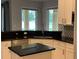 Modern kitchen with granite countertops, stainless steel appliances, and white cabinets at 2258 Rickover Pl, Winter Garden, FL 34787