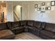 Open living room featuring a plush sectional and stylish decor at 2258 Rickover Pl, Winter Garden, FL 34787
