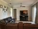Inviting living room with modern decor and entertainment center at 2258 Rickover Pl, Winter Garden, FL 34787