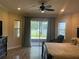 Serene main bedroom with lake view and cozy seating area at 2258 Rickover Pl, Winter Garden, FL 34787