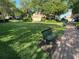 Inviting neighborhood park featuring lush green space and a relaxing bench, perfect for enjoying the outdoors at 2258 Rickover Pl, Winter Garden, FL 34787