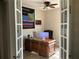 Well-appointed home office with a large desk and natural light at 2258 Rickover Pl, Winter Garden, FL 34787