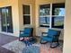 Inviting covered patio with rocking chairs and a view of the water at 2258 Rickover Pl, Winter Garden, FL 34787
