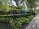 A safe and fun community playground with swings, slides, and greenery, perfect for  at 2258 Rickover Pl, Winter Garden, FL 34787