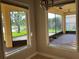Sunroom with two large windows overlooking backyard patio and landscaping at 2258 Rickover Pl, Winter Garden, FL 34787