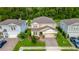 Aerial view of a well-maintained home showcasing its lush landscaping and inviting curb appeal at 2335 Green Symphony Pl, Oviedo, FL 32765