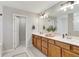 Bathroom with double vanity, tile floor, and full mirror at 2335 Green Symphony Pl, Oviedo, FL 32765