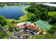 Aerial view of community pool, clubhouse, tennis court and surrounding landscaping at 234 Afton Sq # 305, Altamonte Springs, FL 32714