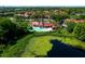 Overhead view of community pool, tennis courts, clubhouse, and water feature at 234 Afton Sq # 305, Altamonte Springs, FL 32714