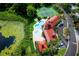 Aerial view of community pool, tennis courts, and lake with lilly pads at 234 Afton Sq # 305, Altamonte Springs, FL 32714