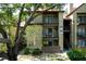 Condominium exterior showcasing balconies, a red roof, and verdant landscaping for inviting curb appeal at 234 Afton Sq # 305, Altamonte Springs, FL 32714