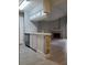 Kitchen open to living room with breakfast bar, fireplace, and tile flooring at 234 Afton Sq # 305, Altamonte Springs, FL 32714