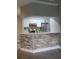 Kitchen featuring white cabinets, stainless steel appliances, a breakfast bar, and hard floors at 234 Afton Sq # 305, Altamonte Springs, FL 32714