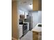 Well-lit kitchen featuring stainless steel appliances, white cabinetry, and stone backsplash at 234 Afton Sq # 305, Altamonte Springs, FL 32714